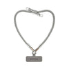 Silver BlingBling wristlet strap displayed on strap card with Tiny Bulb reflector ends