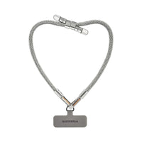 Silver BlingBling wristlet strap displayed on strap card with Tiny Bulb reflector ends