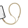 Adjustable golden phone crossbody strap connected to iPhone charging port