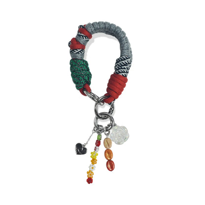 Lyra handle in hand-braided TENCEL™ hanging with charm attachments
