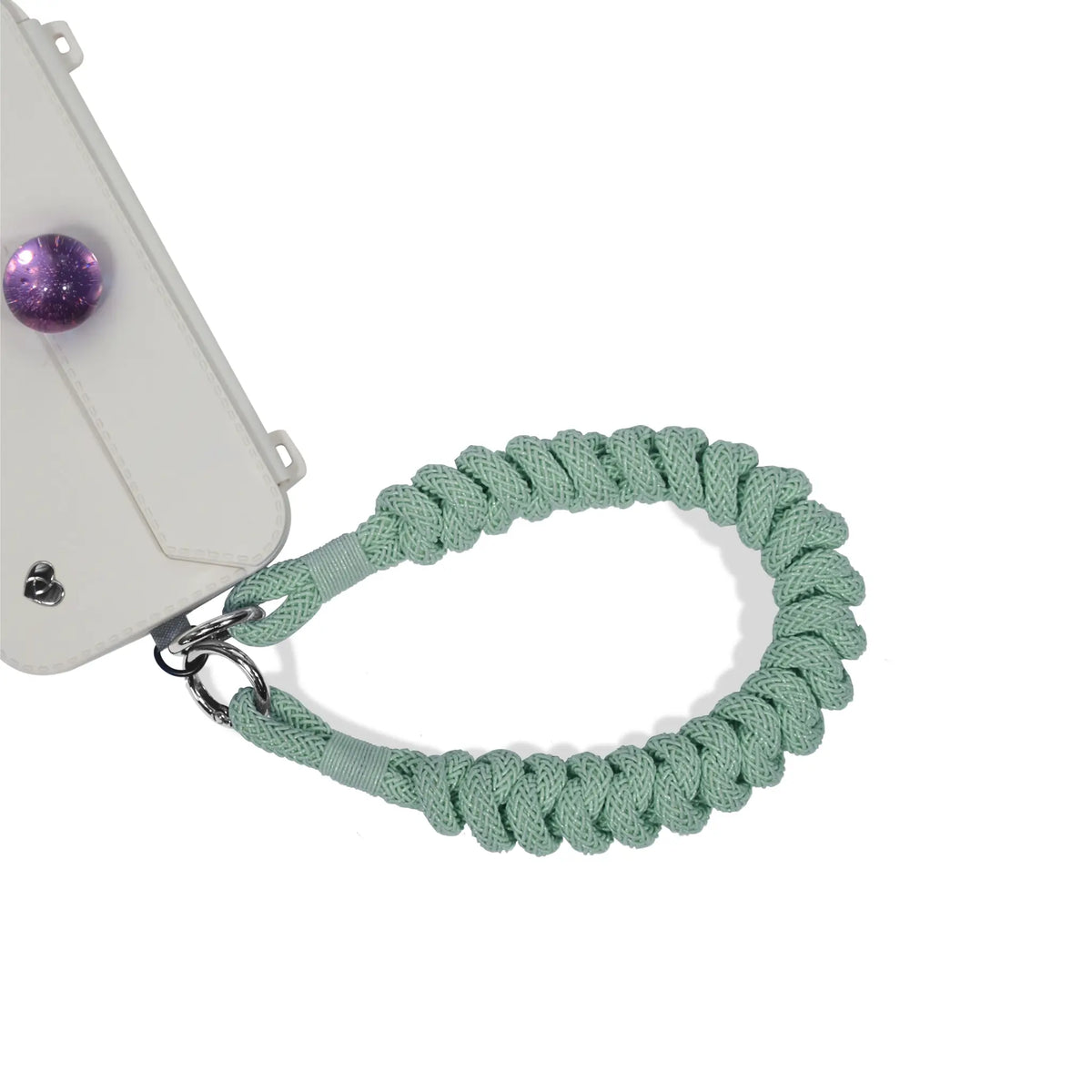 Wristlet secured to phone port during outdoor activity in mint green