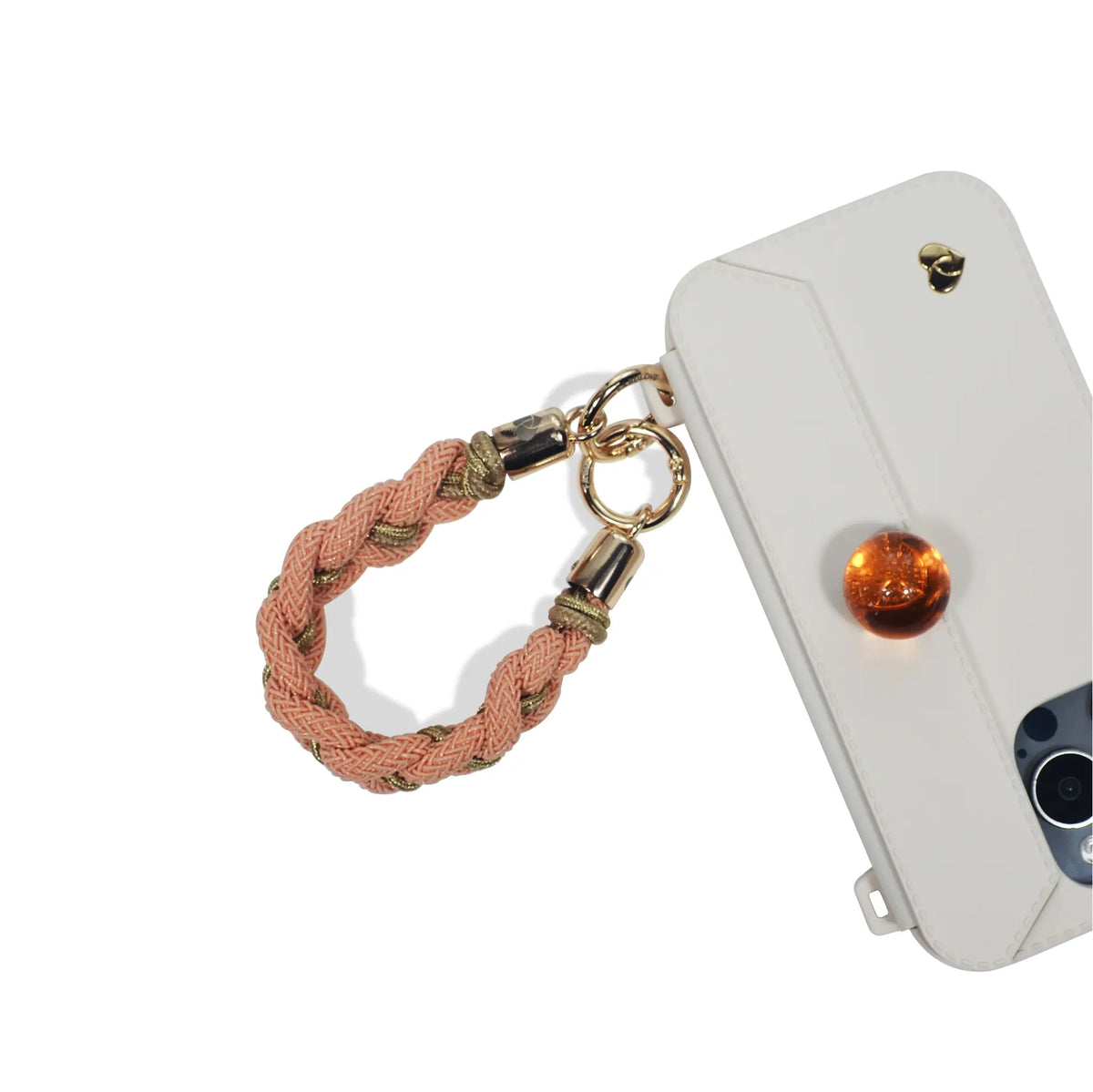 Mini strap as playful keychain charm on phone case in peach orange